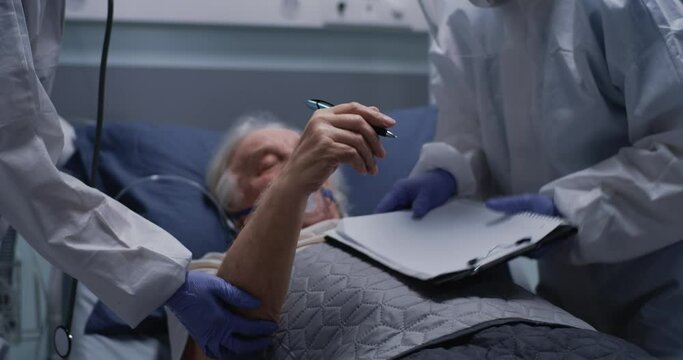 Senior man writing message to crop doctors