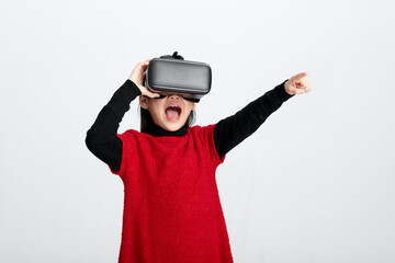 Cute Asian little girl playing with VR glasses