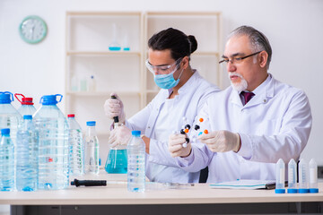 Two chemists working in the lab