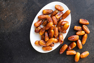 date fruit sweet dried fruits tasty healthy snack diet top view copy space  vegan or vegetarian rustic food background keto or paleo diet 