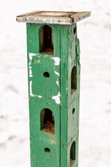 Bird feeder in the park. Multi-tiered feeder installed in the forest.
