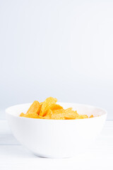 Roasted potatoes chips in big bowl