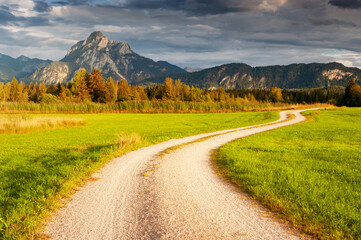 Fototapeta na wymiar Dirt road Alps mountain landscape Bavaria Germany