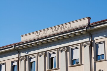 School building facade with scuole comunali inscription in Lugano, Switzerland