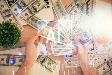 Multi exposure of technology drawing hologram and us dollars bills and man hands. Data concept