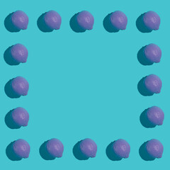 Colorful frame pattern made with purple lemon on light blue background. Minimal purple concept.