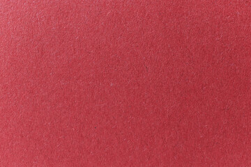 Fototapeta premium Burgundy colored paper texture background, paper surface close-up