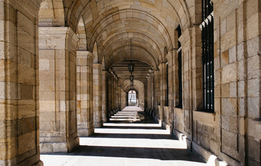 archway with old lamps in santiago de compostella 