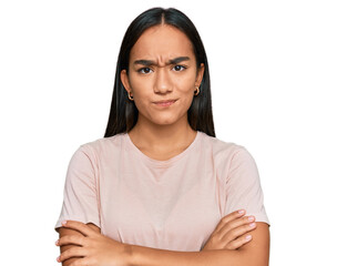 Young asian woman wearing casual clothes skeptic and nervous, disapproving expression on face with...