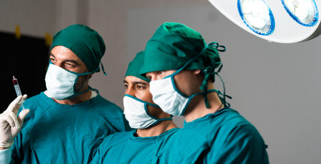 Fototapeta na wymiar Medical Team Performing Surgical Operation in Operating Room. Doctor and team have skilled and recognized.