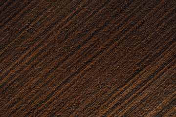 Top view of brown land in plowed field