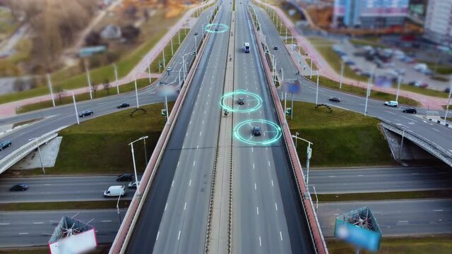 Autonomous Self Driving Cars Moving Through City Highway. Speed and identity Control System. Future transportation. Artificial Intelligence Digitalizes and Analyzes Road. Shot from drone.