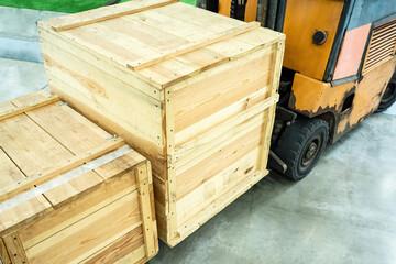 Wooden crates on a loading machine. Concept - transport and loading machine. Loading and unloading...