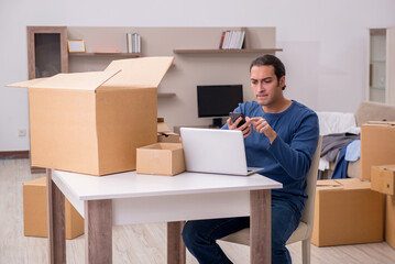 Young man moving to new flat