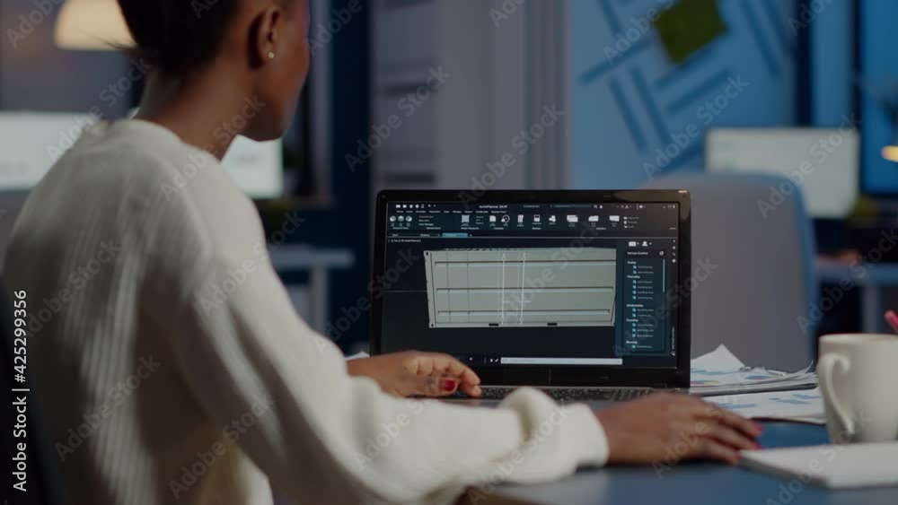 Poster black freelancer architect working in 3d software to elaborate container design sitting at desk in b
