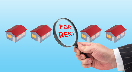 House for rent. Real estate for rent. Inscription for rent as symbol leasing property. Finding suitable rental properties. Realtor hand with a magnifying glass. Real estate agent looking for tenants