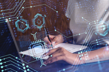 A client is signing a contract to create a new software to present it in start up conference and gain investments to create a product. Technological graph over the desk. Women in business concept.