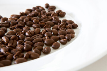 Scattered Coffee Beans on a Dish