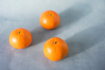 tangerines on wooden background