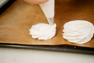 Cake Anna Pavlova. The process of making a cake Anna Pavlova. The pastry chef decorates the cake Anna Pavlova. Making a cake Anna Pavlova.
