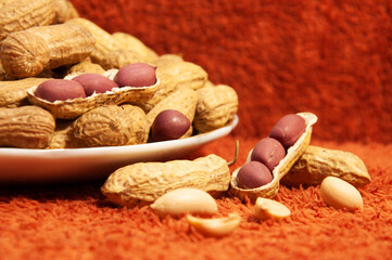 roasted peanuts in shell in a ceramic bowl