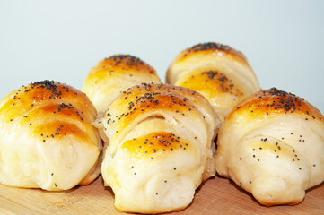Freshly baked buns with poppy seeds