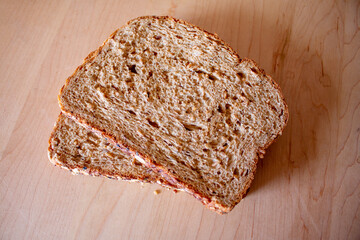 sandwich slices of whole wheat multi grain bread wood kitchen table