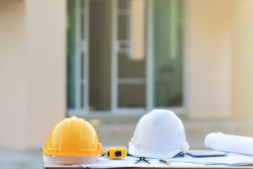White helmets are placed on the side tables, documents and house plans to prepare teams of...