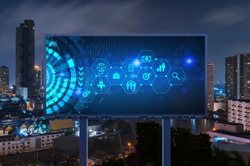 Research and technological development glowing icons on billboard. Night panoramic city view of Bangkok. Concept of innovative activities expanding new services or products in Southeast Asia.