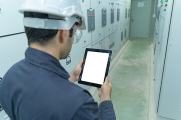 An engineer man or worker, people using a tablet device with blank screen space, working in...