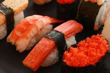 Various toppings of delicious sushi are placed on plates in Japanese restaurants. It is a very popular dish of Japan.