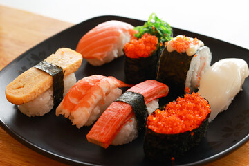 Various toppings of delicious sushi are placed on plates in Japanese restaurants. It is a very popular dish of Japan.