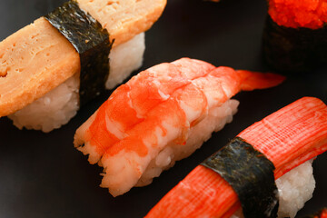 Various toppings of delicious sushi are placed on plates in Japanese restaurants. It is a very popular dish of Japan.