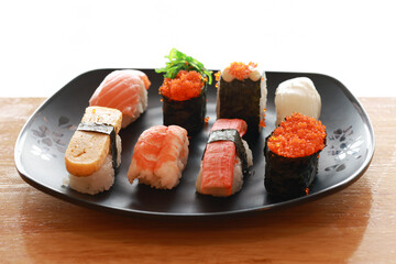 Various toppings of delicious sushi are placed on plates in Japanese restaurants. It is a very popular dish of Japan.