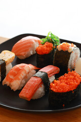 Various toppings of delicious sushi are placed on plates in Japanese restaurants. It is a very popular dish of Japan.