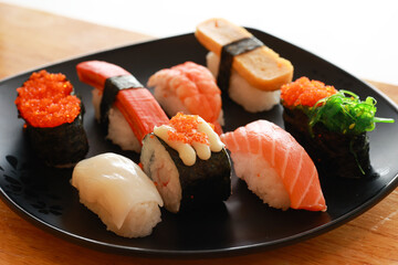 Various toppings of delicious sushi are placed on plates in Japanese restaurants. It is a very popular dish of Japan.