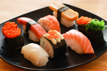 Various toppings of delicious sushi are placed on plates in Japanese restaurants. It is a very popular dish of Japan.