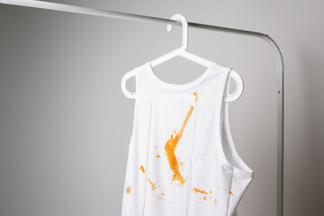 White cotton shirt So many stains and dirt. Hanging on the clothesline in the room Must be washed...