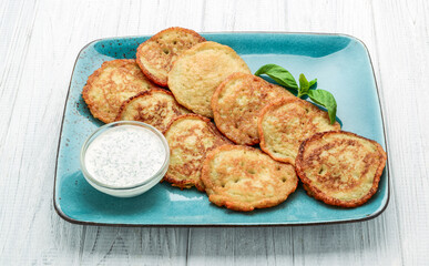 Delicious homemade breakfast with pancakes on wooden background