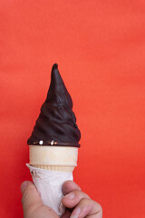 Chocolate Cone Ice Cream Isolated On Red Background