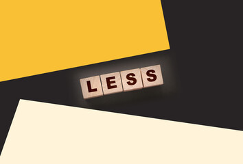 Less word on wooden cubic blocks. Spend less or cut costs business concept