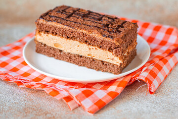 gluten free cake piece sugar-free and lactose free chocolate cream layers trend meal copy space food background rustic. top view