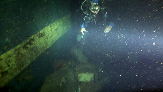 Ship wreck Salem Express underwater in the Red Sea in Egypt. Extreme tourism on ocean floor in world of coral reefs, fish, sharks. Researchers of wildlife blue abyss. Deep diving.