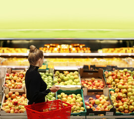 Woman buying fruits at the market
