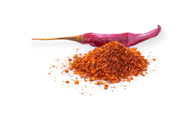 pile crushed red cayenne pepper, dried chili flakes and seeds on white background.