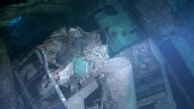 Ship wreck Salem Express underwater in the Red Sea in Egypt. Extreme tourism on ocean floor in world of coral reefs, fish, sharks. Researchers of wildlife blue abyss. Deep diving.