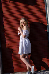 Naklejka premium White young girl near wall