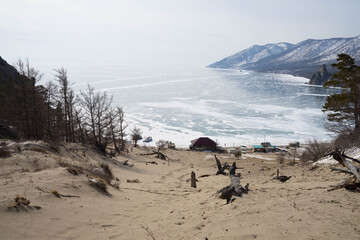 sandy bay on a winter lake