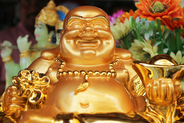 laughing golden Buddha or Hotey - ("canvan bag") - the figure of diety, the symbol of prosperity, wisdom and generosity. One of seven gods of happiness.