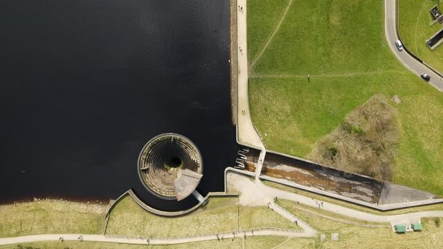 People Walking At Dovestone Reservoir Plug Hole Aerial Drone Fly Over Peak District National Park Greenfield Saddleworth Moor Manchester